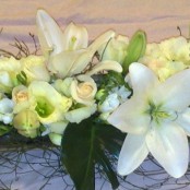 Rustic Long and Low Arrangement lilies, lisianthus, roses (1470206055)